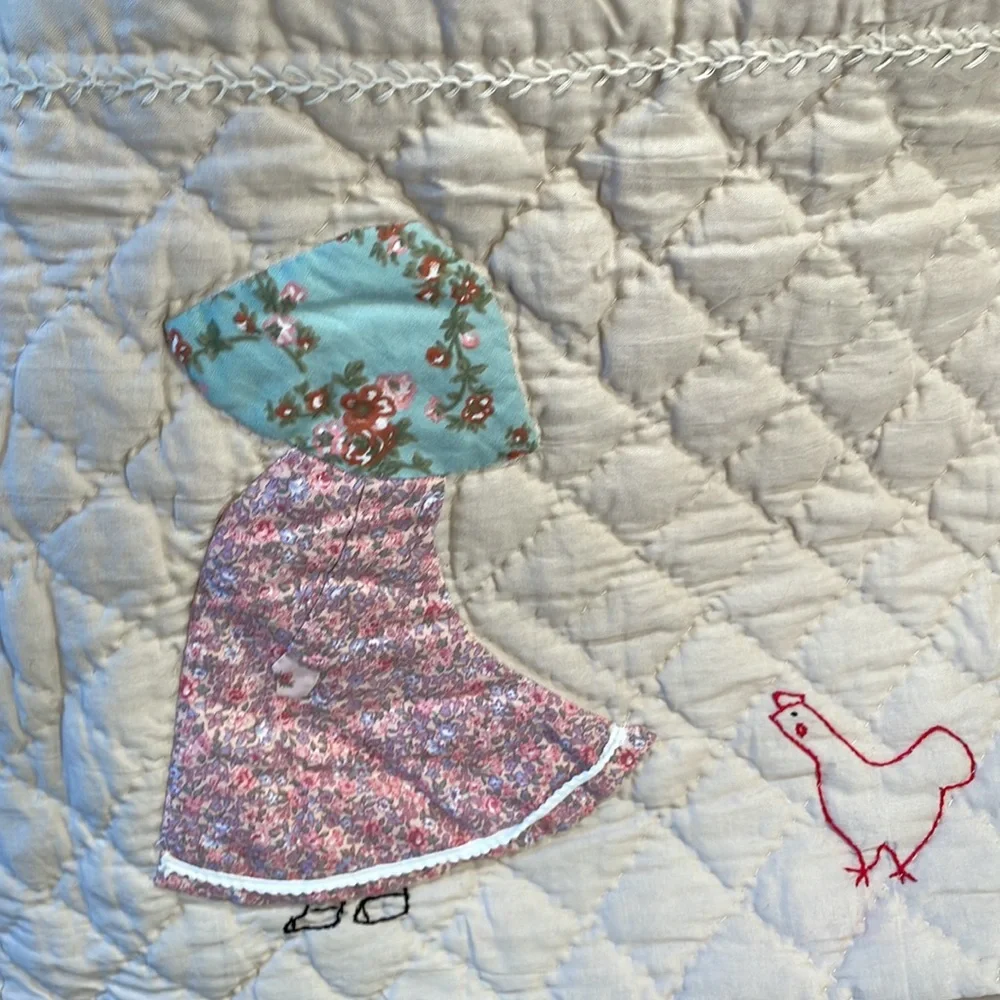 Appliqued and embroidered quilt